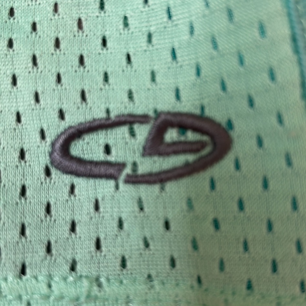 Champion. The inside the spandex is a light gray, the shorts are a light teal. - Picture 2 of 3